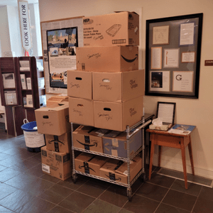 Cart full of donation boxes for Sanctuary DMV